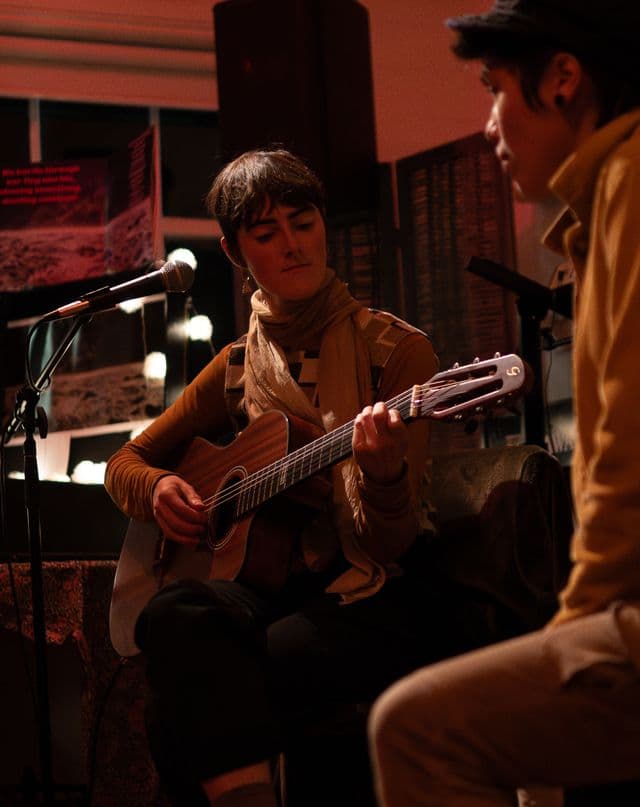 Piper Allen playing guitar